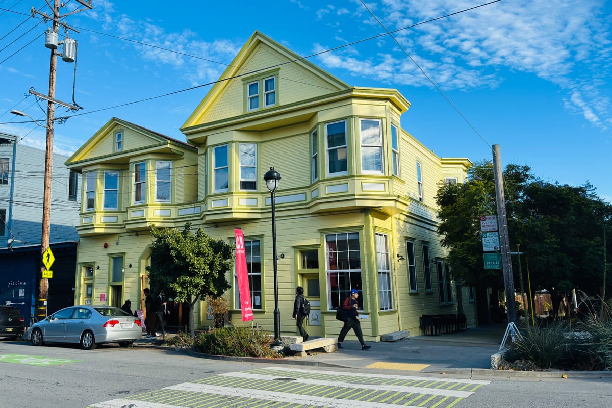 A restored corner Victorian in San Francisco's Dogpatch, with the neighborhood's mix of period houses and newer construction behind.