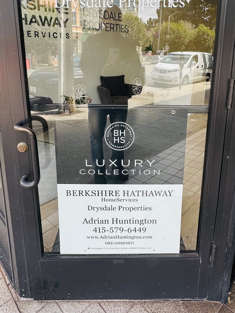 The office door at 2425 California Street, San Francisco, lettered with Berkshire Hathaway HomeServices Drysdale Properties, the Luxury Collection mark, and Adrian Huntington's name, phone number and DRE licence number.